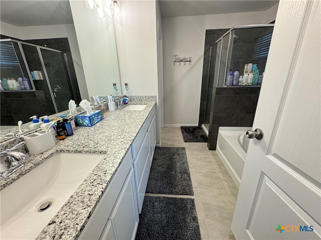 bathroom featuring tile patterned flooring, vanity, and plus walk in shower