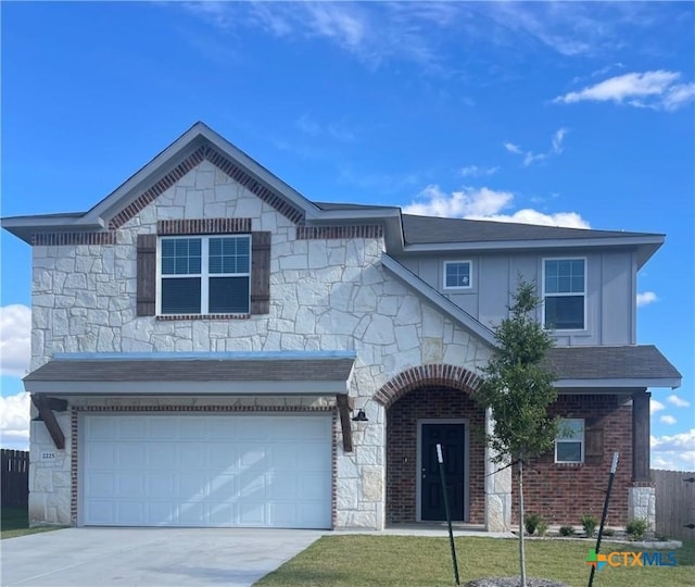 front of property with a garage and a front yard