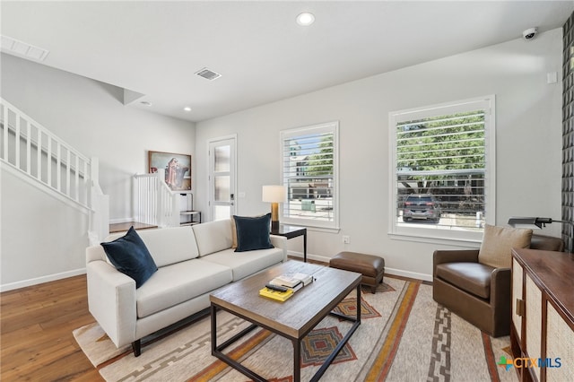 13900 Zink Bnd Unit 61, Austin, TX 78717 - living area featuring light wood-style flooring, baseboards, stairs, and recessed lighting