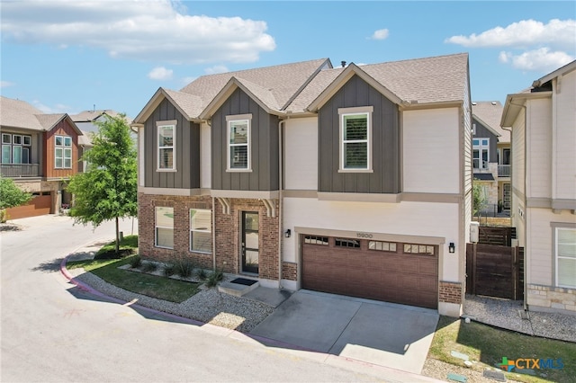 13900 Zink Bnd Unit 61, Austin, TX 78717 - view of property featuring board and batten siding, an attached garage, driveway, and brick siding
