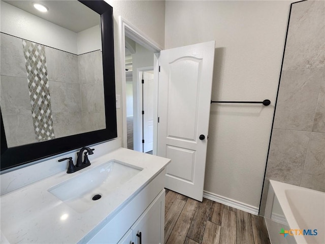 719 Eagle Claw Dr, Salado, TX 76571 - full bathroom featuring vanity, wood finished floors, and baseboards