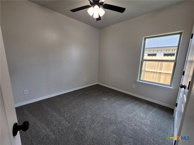 719 Eagle Claw Dr, Salado, TX 76571 - unfurnished room featuring dark colored carpet, ceiling fan, and baseboards