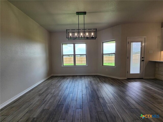 719 Eagle Claw Dr, Salado, TX 76571 - unfurnished dining area with dark wood-style floors, healthy amount of natural light, and baseboards