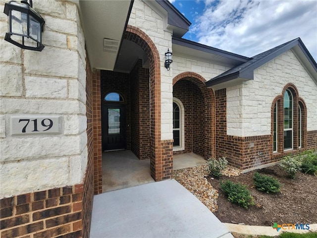 719 Eagle Claw Dr, Salado, TX 76571 - doorway to property with brick siding and stone siding