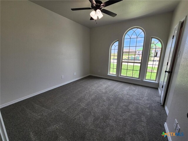 719 Eagle Claw Dr, Salado, TX 76571 - spare room featuring dark carpet, baseboards, and a ceiling fan