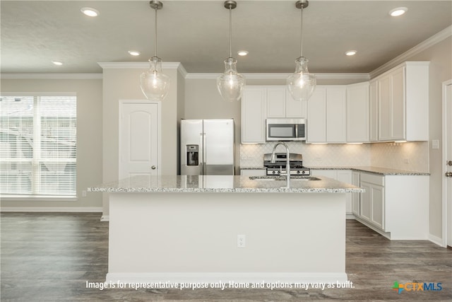 kitchen with appliances with stainless steel finishes, an island with sink, dark hardwood / wood-style floors, and white cabinets