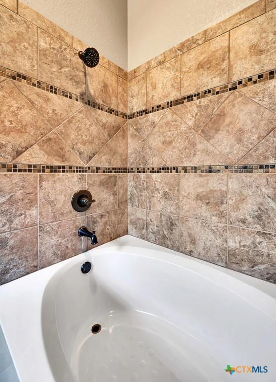 bathroom with shower / washtub combination