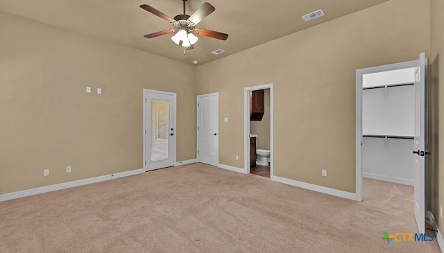 unfurnished bedroom with baseboards, visible vents, and carpet