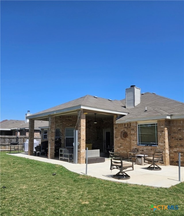 2415 Merle Dr, Copperas Cove, TX 76522 - rear view of house with a patio area, brick siding, and a chimney
