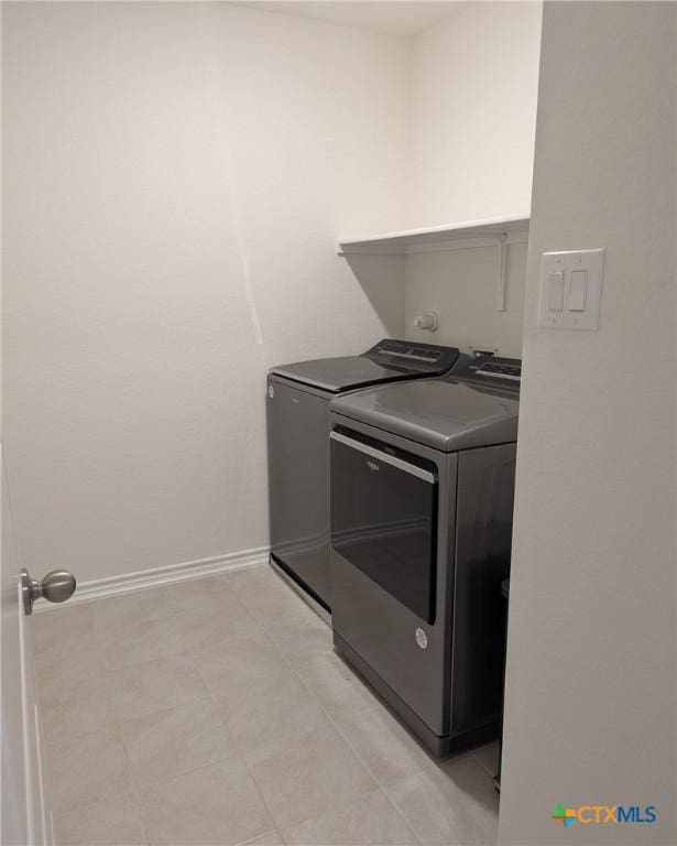 4177 Harper Lee Ln, New Braunfels, TX 78130 - washroom featuring washing machine and dryer and baseboards