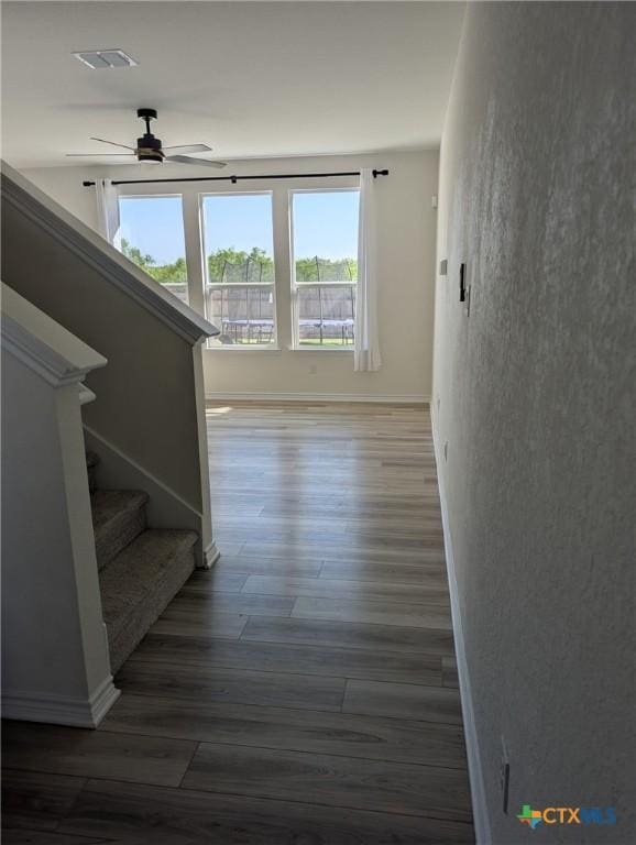 4177 Harper Lee Ln, New Braunfels, TX 78130 - hall with wood finished floors, stairs, and baseboards