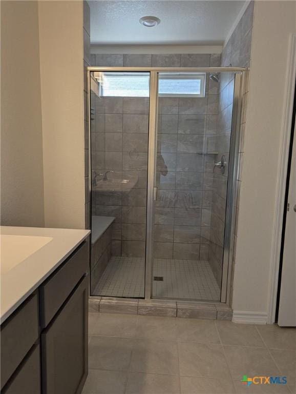 4177 Harper Lee Ln, New Braunfels, TX 78130 - bathroom featuring vanity, tile patterned floors, and a stall shower