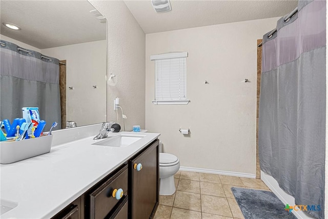 5920 Stonehaven Dr, Temple, TX 76502 - full bathroom with vanity, toilet, tile patterned floors, a shower with curtain, and baseboards