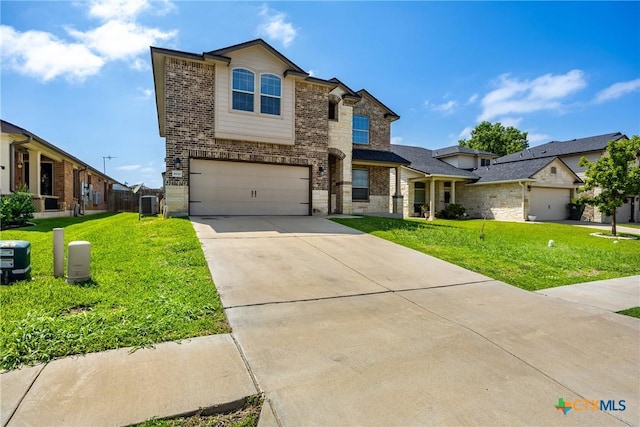 5920 Stonehaven Dr, Temple, TX 76502 - view of front facade featuring stone siding, an attached garage, concrete driveway, brick siding, and a front lawn