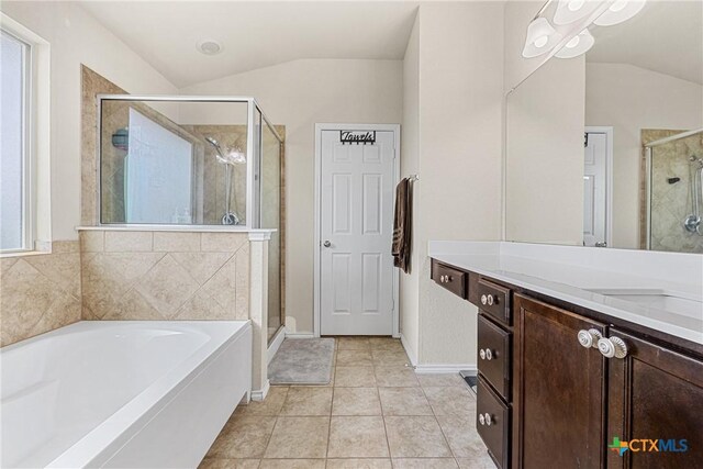 5920 Stonehaven Dr, Temple, TX 76502 - full bathroom featuring lofted ceiling, vanity, a bath, a shower stall, and tile patterned floors