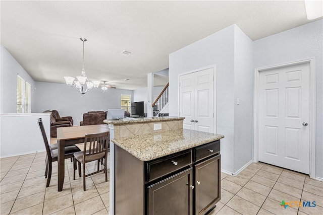 5920 Stonehaven Dr, Temple, TX 76502 - kitchen featuring light tile patterned floors, a chandelier, plenty of natural light, and open floor plan