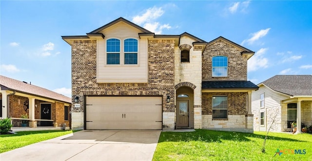 5920 Stonehaven Dr, Temple, TX 76502 - view of front facade with an attached garage, brick siding, driveway, a front yard, and stone siding