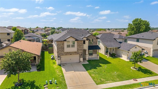 5920 Stonehaven Dr, Temple, TX 76502 - view of front of house with a residential view, stone siding, and concrete driveway