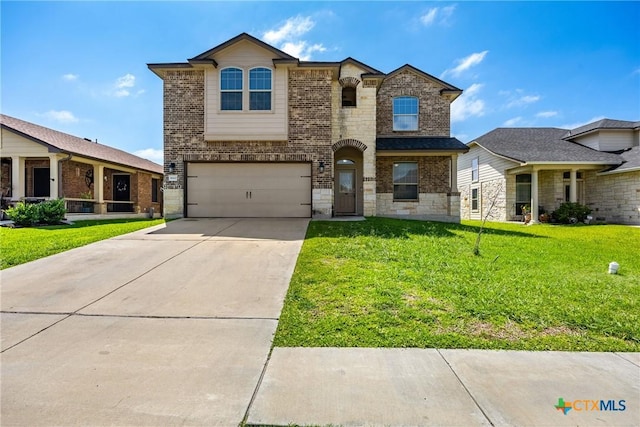 5920 Stonehaven Dr, Temple, TX 76502 - view of front of house featuring brick siding, a garage, a front yard, concrete driveway, and stone siding