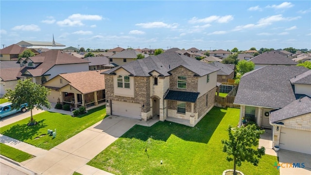 5920 Stonehaven Dr, Temple, TX 76502 - view of front facade featuring a residential view, a garage, driveway, stone siding, and a front yard