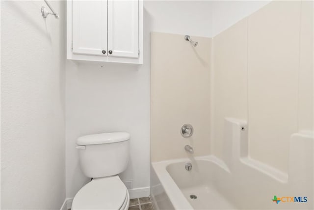 bathroom featuring toilet and tub / shower combination