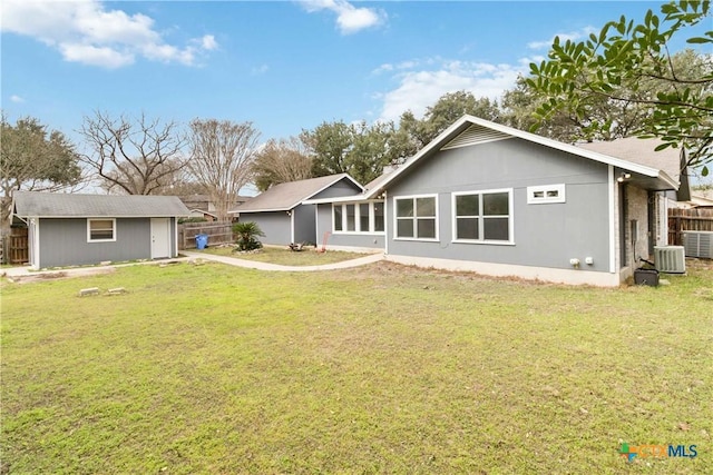 back of property with a yard and cooling unit