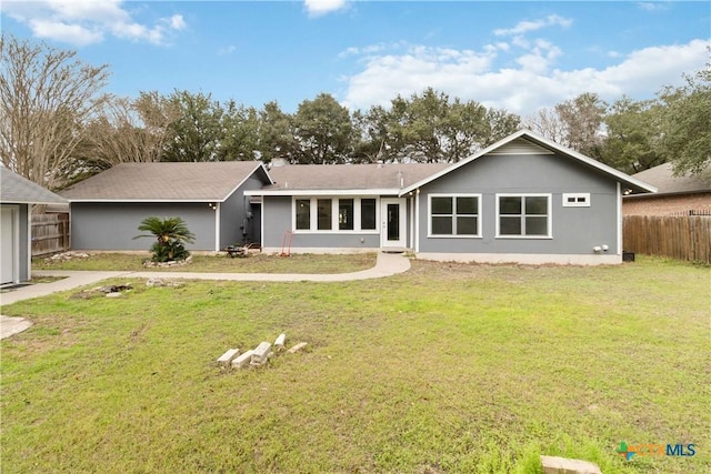 ranch-style home with a front yard