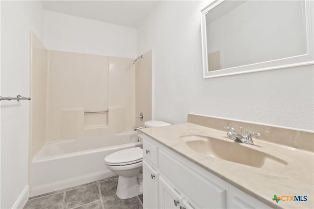 full bathroom featuring tile patterned floors, toilet, bathing tub / shower combination, and vanity