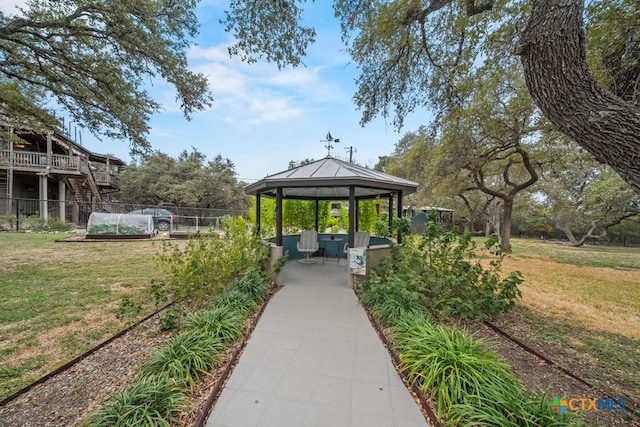 view of home's community featuring a gazebo, a yard, and fence