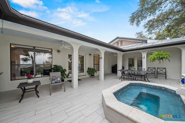 view of swimming pool with a patio area and ceiling fan