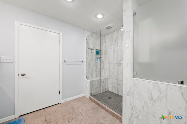 bathroom featuring an enclosed shower