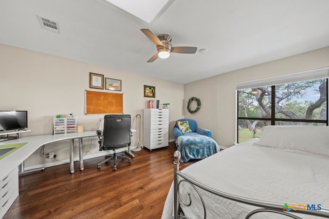 bedroom featuring ceiling fan and dark hardwood / wood-style flooring