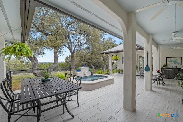 view of patio featuring an outdoor hot tub and ceiling fan