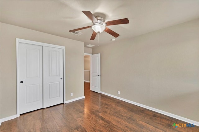 unfurnished bedroom with visible vents, baseboards, wood finished floors, a closet, and a ceiling fan