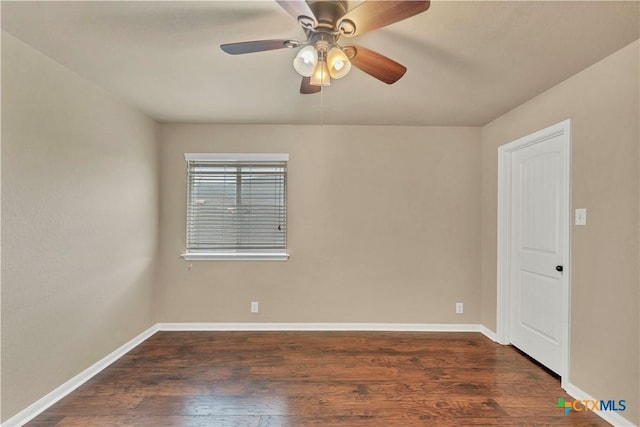 spare room featuring ceiling fan, baseboards, and wood finished floors