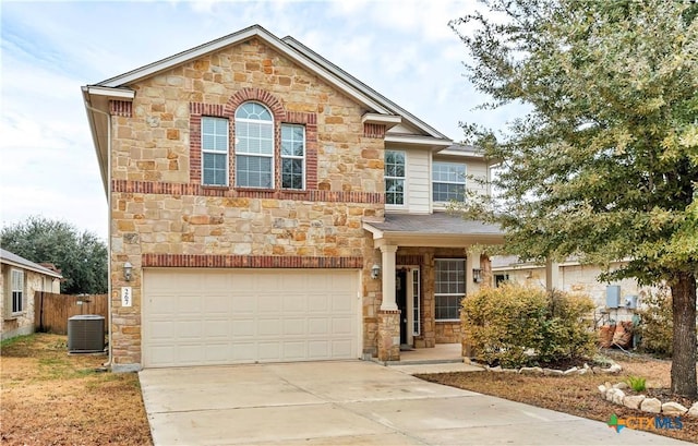 view of front facade featuring stone siding, concrete driveway, and an attached garage