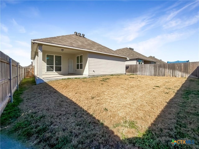 rear view of property featuring a patio area