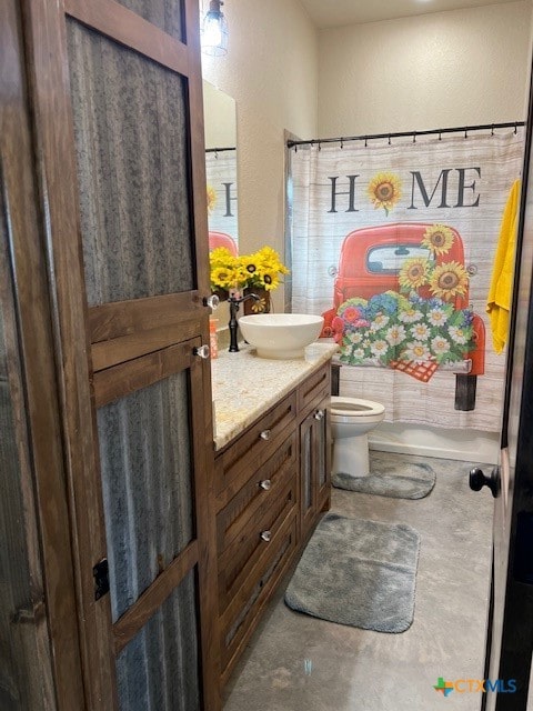 bathroom featuring concrete flooring, vanity, toilet, and a shower with curtain