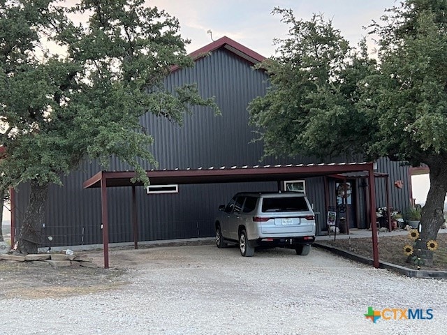 view of front of home with a carport