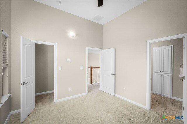 171 Clear Rdg, New Braunfels, TX 78132 - unfurnished bedroom featuring visible vents, baseboards, high vaulted ceiling, and light colored carpet