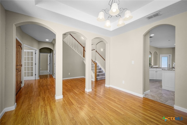 171 Clear Rdg, New Braunfels, TX 78132 - interior space with arched walkways, light wood-style floors, visible vents, and a notable chandelier
