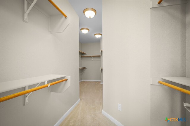 171 Clear Rdg, New Braunfels, TX 78132 - walk in closet featuring light colored carpet