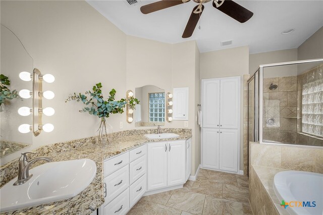 171 Clear Rdg, New Braunfels, TX 78132 - full bathroom featuring a ceiling fan, a sink, visible vents, and a stall shower