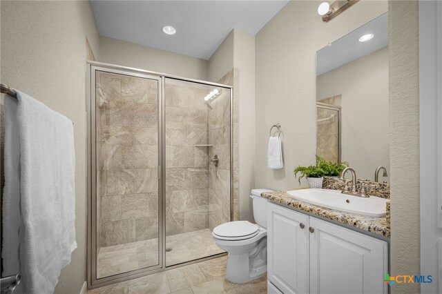 171 Clear Rdg, New Braunfels, TX 78132 - bathroom with toilet, vanity, and a stall shower