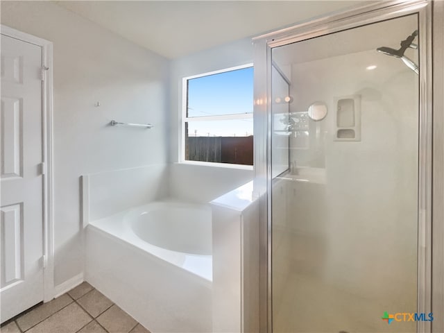 bathroom featuring shower with separate bathtub and tile patterned floors