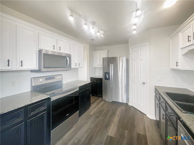 kitchen with white cabinetry, sink, dark hardwood / wood-style floors, and stainless steel appliances