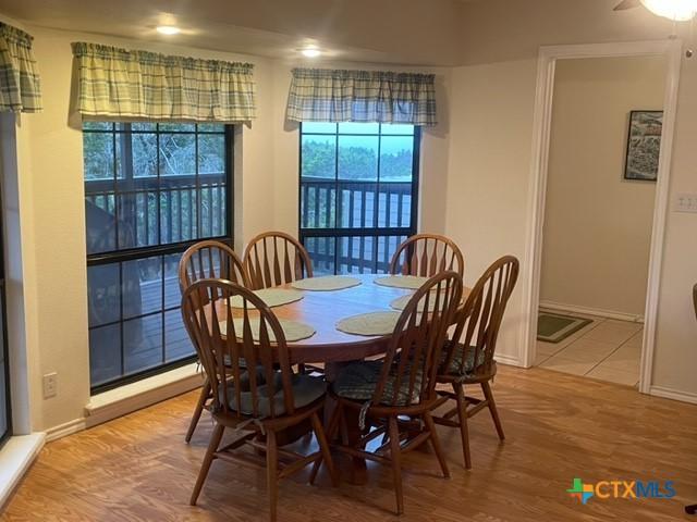 dining room with wood finished floors and baseboards