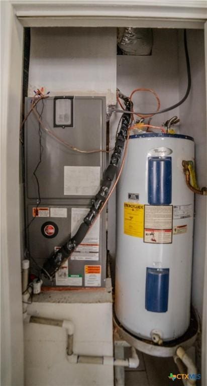 utility room featuring electric water heater