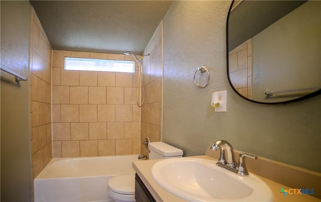 full bathroom featuring toilet, vanity, and tiled shower / bath