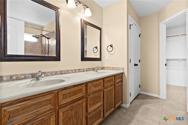 bathroom with tile patterned flooring and vanity